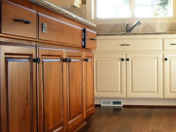 Affordable Screening & Painting LLC finishes cabinets in Sydney
